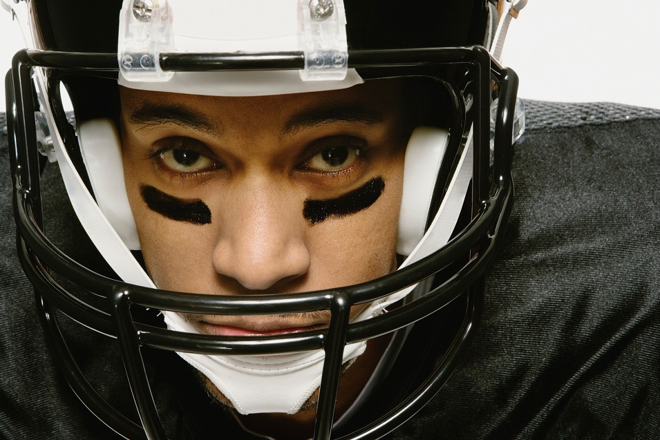 Man wearing a football helmet.