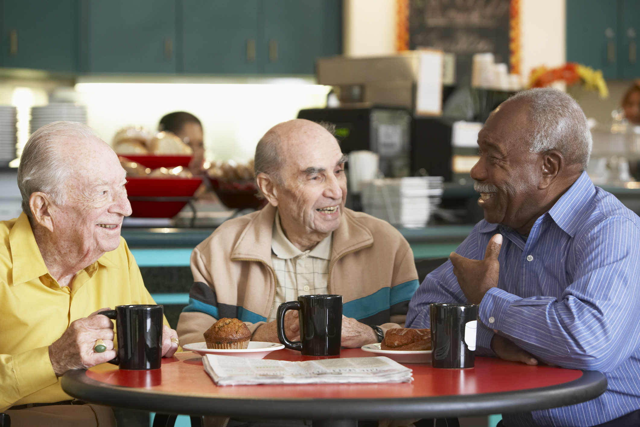 Older adult men drinking tea together