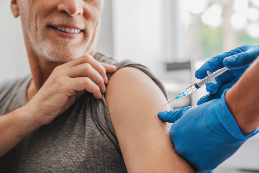 An older adult getting a vaccine